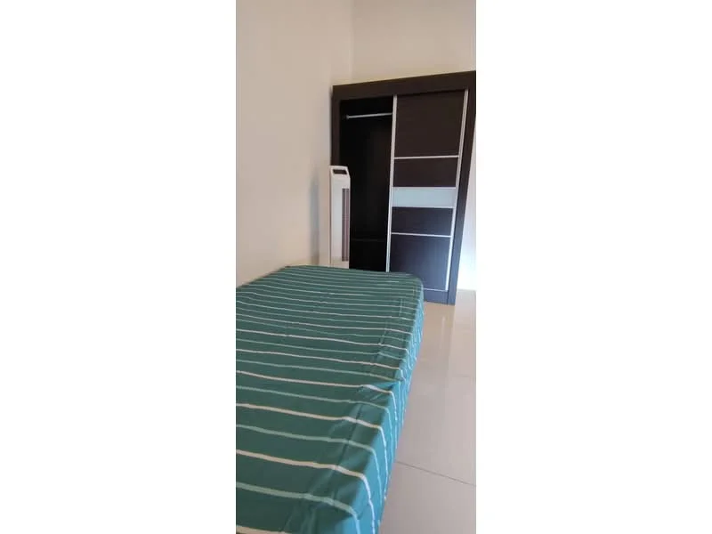 Bedroom features: single bed with striped bedding, built-in wardrobe with sliding doors, white walls, glossy tile flooring, floor-to-ceiling window, air conditioning unit; style: modern.