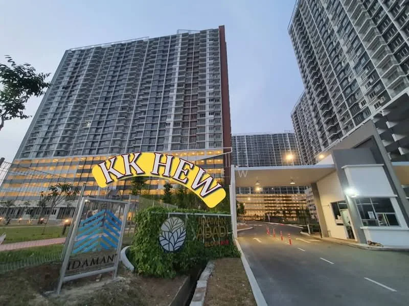 Exterior type: high-rise condominium; features: glass curtain wall, multiple-storey facade, main entrance gate, security guard house at entrance, landscaped greenery, driveway with interlocking pavers; style: modern.