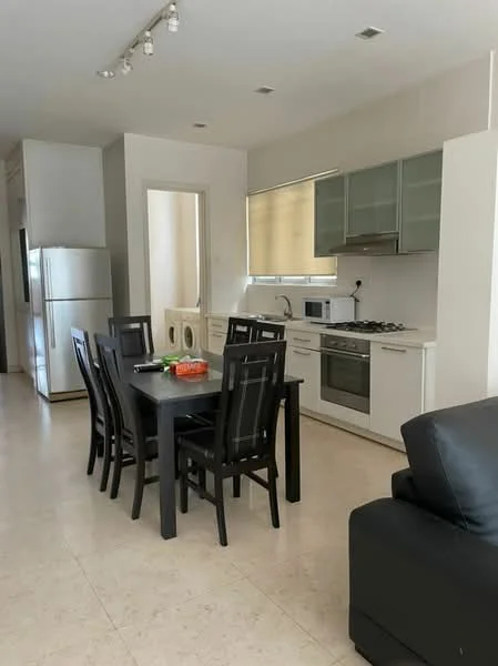 Dining features: 6-seater dining table, black dining chairs, kitchen cabinetry with glass-front upper cabinets, stainless-steel gas hob, built-in oven, microwave, stainless-steel fridge, cream walls, tile flooring, recessed ceiling lights, window with blinds; style: modern. Kitchen features: stainless-steel gas hob, built-in oven, microwave, kitchen cabinetry with glass-front upper cabinets, cream walls, tile flooring; style: modern.