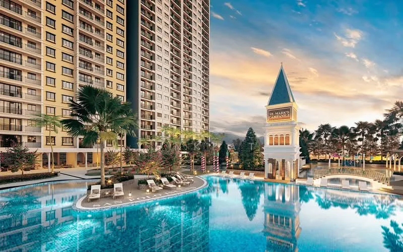 Exterior type: high-rise condominium; features: infinity pool, pool deck with loungers, landscaped garden with palm trees, decorative tower with spire, surrounding greenery, multiple-storey residential building, water feature, outdoor lighting; style: modern.