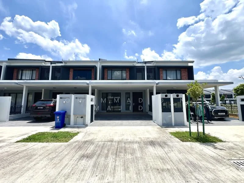 Exterior type: linked terrace house; features: two-storey building, brick facade, white painted facade, large windows, covered car porch, manicured lawn, paved driveway, front garden, security gate, modern architectural design, clear blue sky, surrounded by greenery; style: modern.