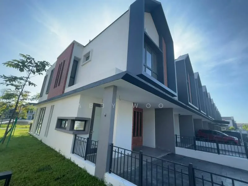 Exterior type: linked terrace house; features: white painted facade, red brick accents, flat roof, two-storey, manicured lawn, paved walkway, fenced front yard, large windows, balcony on upper floor, parking space in front; style: modern.