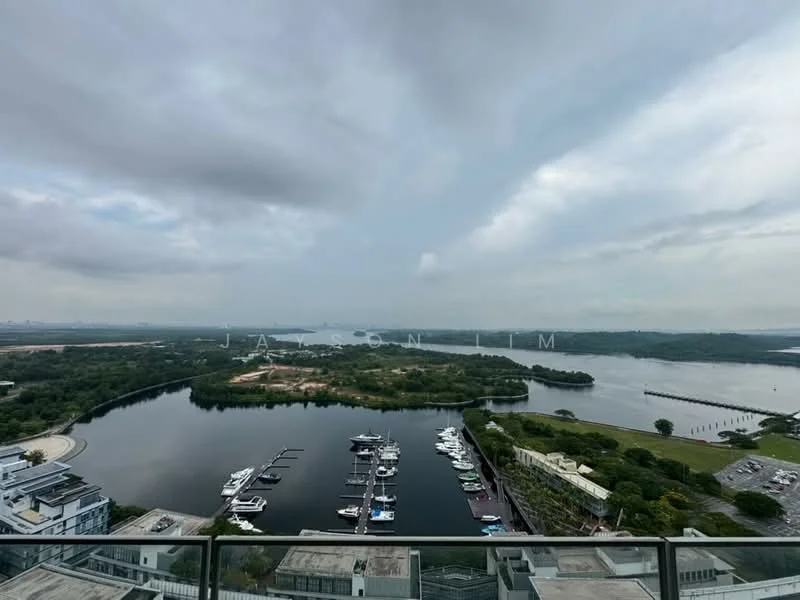 Exterior type: high-rise condominium; features: waterfront view, marina with boats, lush greenery, city skyline in background, river view, surrounding landscape, modern architecture, balcony railing, cloudy sky; style: modern.