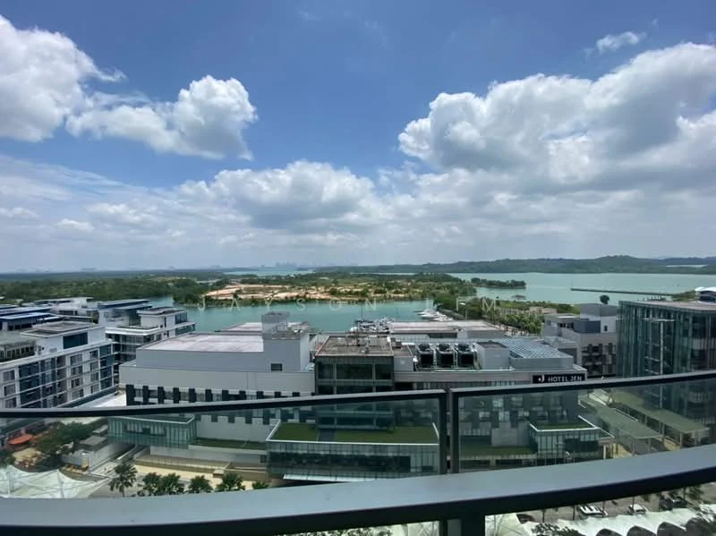 Exterior type: high-rise condominium; features: panoramic view of water, surrounding greenery, city skyline in background, multiple buildings in view, balcony railing, cloudy sky, open space, landscaped area; style: modern.