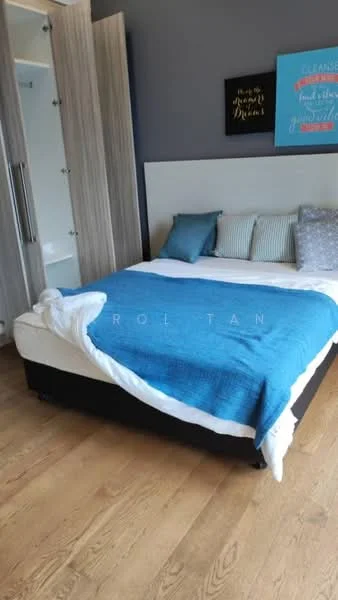 Bedroom features: queen-size bed with white bedding, blue throw blanket, upholstered headboard, wooden flooring, decorative pillows, built-in wardrobe with sliding doors, framed artwork on wall, grey accent wall, natural light from window; style: modern.