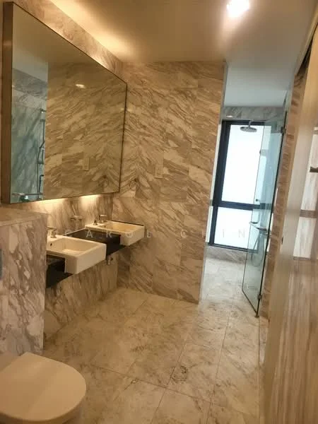 Bathroom features: marble tile flooring, marble wall cladding, double-sink vanity with wall-mounted faucets, large framed mirror, glass shower enclosure, one-piece toilet, recessed lighting, sliding glass door, neutral color palette; style: modern.