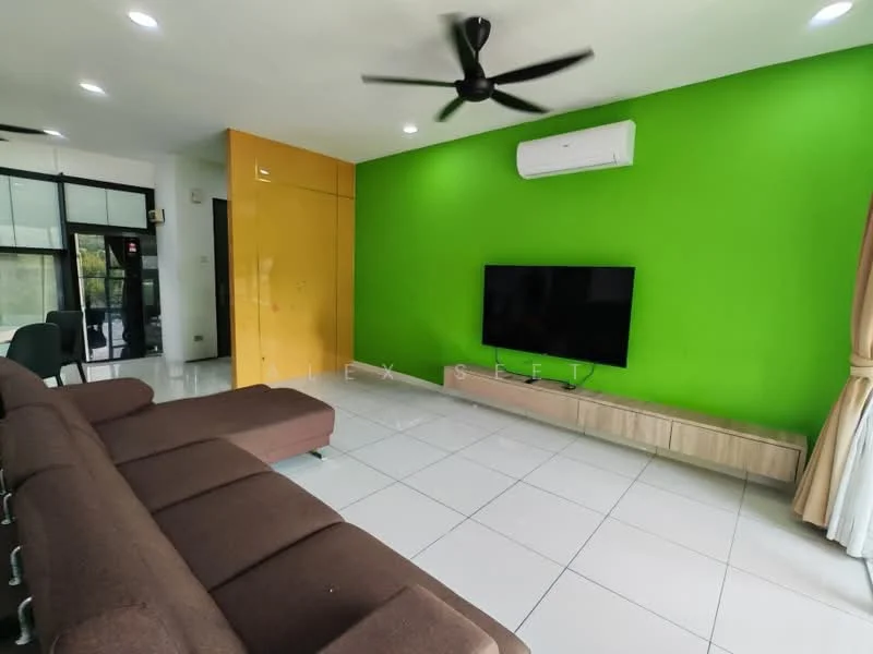 Living features: brown fabric sectional sofa, white tiled flooring, green accent wall, white painted walls, wall-mounted flat-screen TV, wooden TV console, ceiling fan, air conditioning unit, large windows with sheer curtains; style: modern.