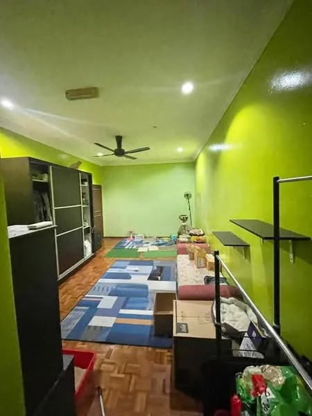 Room features: green painted walls, wooden flooring, 5-blade ceiling fan, recessed downlights, shelves, storage boxes, area rug, lampshade, decorative items.