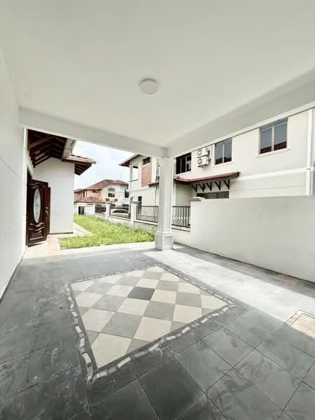 Room features: grey tiled flooring, white painted walls, ceiling light fixture, door with decorative glass panel, exterior wall with window openings, green lawn visible outside, surrounding residential buildings, covered porch area; style: modern; view: garden.