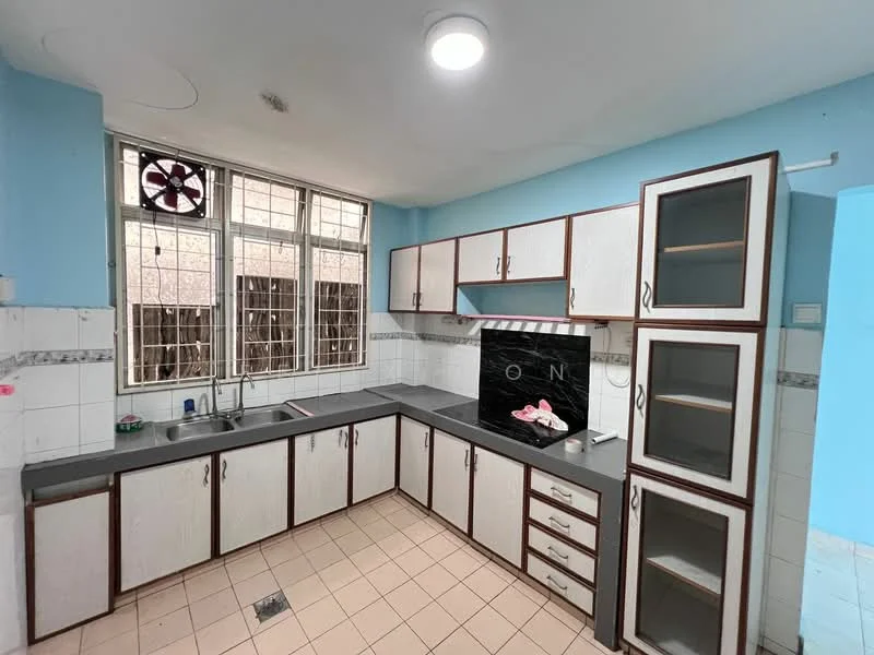 Kitchen features: blue painted walls, grey countertop, white cabinetry with brown trim, double-bowl stainless-steel sink, chrome faucet, built-in oven, tile flooring, window with metal grille, overhead cabinet, base cabinets with drawers, kitchen backsplash, exhaust fan.