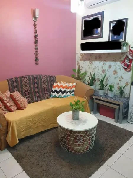 Living features: 3-seater fabric sofa in beige with patterned throw pillows, yellow throw blanket on sofa, round coffee table with metal wire base, area rug with geometric pattern, wall-mounted light fixture, decorative wall hanging, framed artwork on walls, potted plants on side table and floor, white tiled flooring, air conditioning unit mounted on wall; style: contemporary.