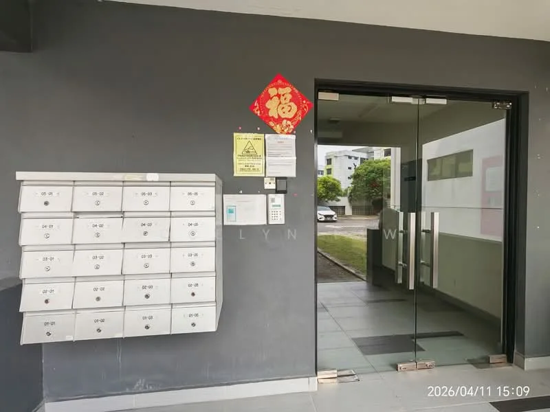 Exterior features: glass entrance door, mailbox unit with multiple compartments, grey painted walls, tiled flooring, security intercom panel, warning sign, decorative wall hanging, landscaped area visible outside; style: modern.
