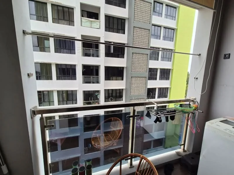Balcony features: glass railing, metal railing, floor-to-ceiling windows, outdoor chair, hanging clothes line, view of building facade, concrete flooring; style: modern; view: city.