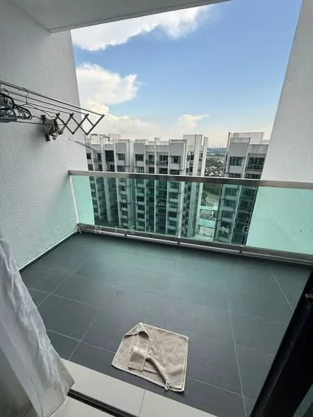 Balcony features: glass railing, grey tiled flooring, clothes drying rack, city skyline view, outdoor space, partial shade from overhang, towel on floor; style: modern; view: city.