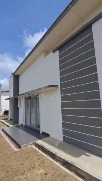 Exterior type: detached bungalow; features: white painted facade, grey accent wall, sliding glass door, concrete walkway, landscaped yard, single-storey, flat roof; style: modern.