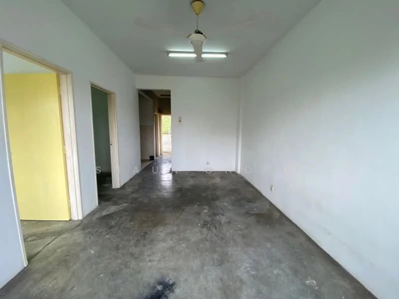Room features: plain white walls, concrete flooring, ceiling fan, two doorways, fluorescent ceiling lights; style: minimalist.