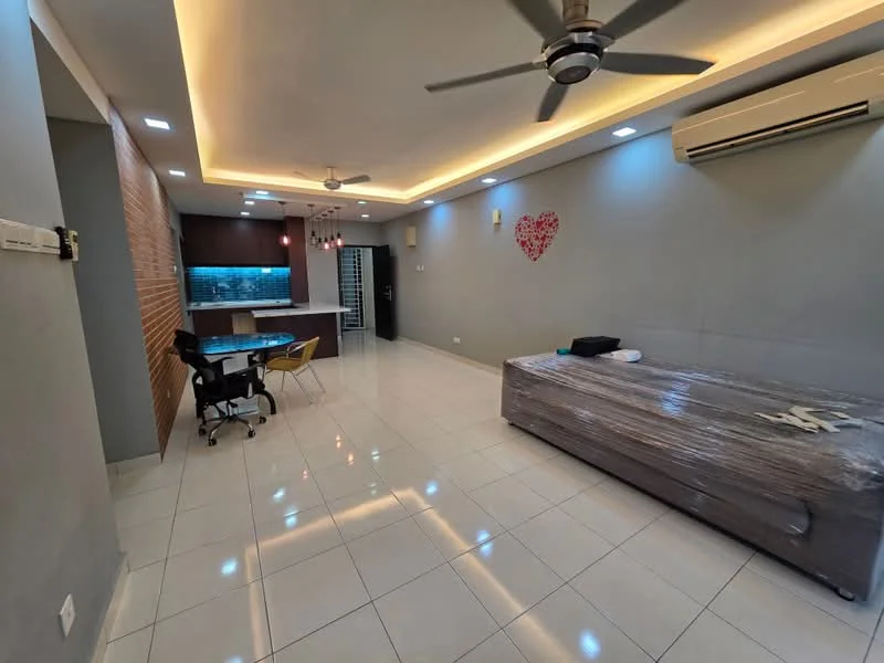 Living features: white painted walls, recessed ceiling lights, 5-blade ceiling fan with light, large floor tiles, sofa covered in plastic, dining table with four chairs, open layout to kitchen, air conditioning unit, decorative wall with heart design, wooden accent wall, sliding door to kitchen, natural light from windows; style: modern. Kitchen features: dark cabinetry, stainless-steel appliances, kitchen island, backlit countertop, open layout to living area; style: modern.