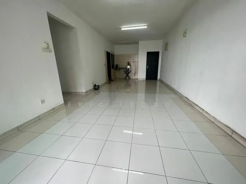 Room features: white painted walls, glossy ceramic tile flooring, recessed ceiling lights, open layout, kitchen area visible in background, single wall with no visible features, no furniture present, neutral color scheme; style: minimalist.