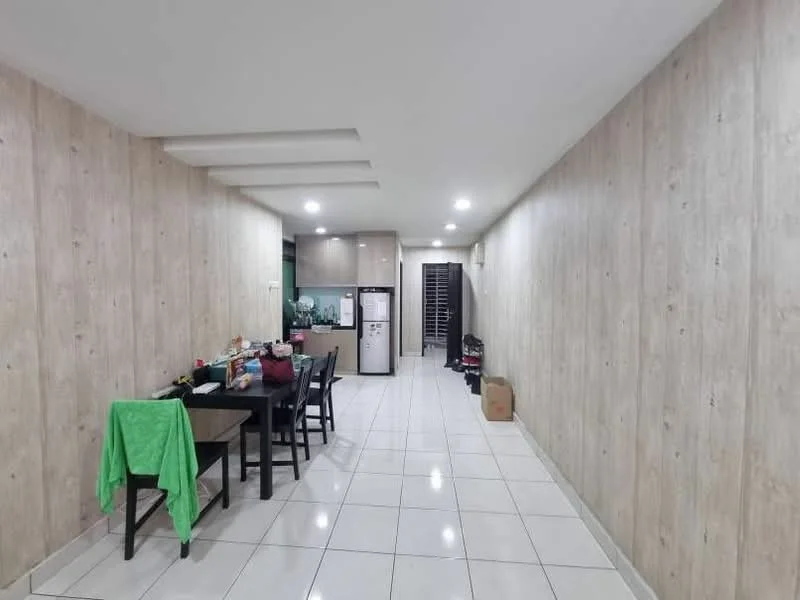 Room features: white tiled flooring, light wood panelled walls, recessed ceiling lights, dining table with four chairs, green cloth draped over a chair, black refrigerator, kitchen area visible in the background, open layout, wall-mounted air conditioning unit, storage area with shelves; style: modern.