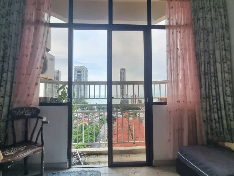 Room features: floor-to-ceiling windows, sliding glass door, pink sheer curtains, tile flooring, balcony view, city skyline view, greenery visible outside, decorative chair, sofa, curtains with floral pattern; view: city.
