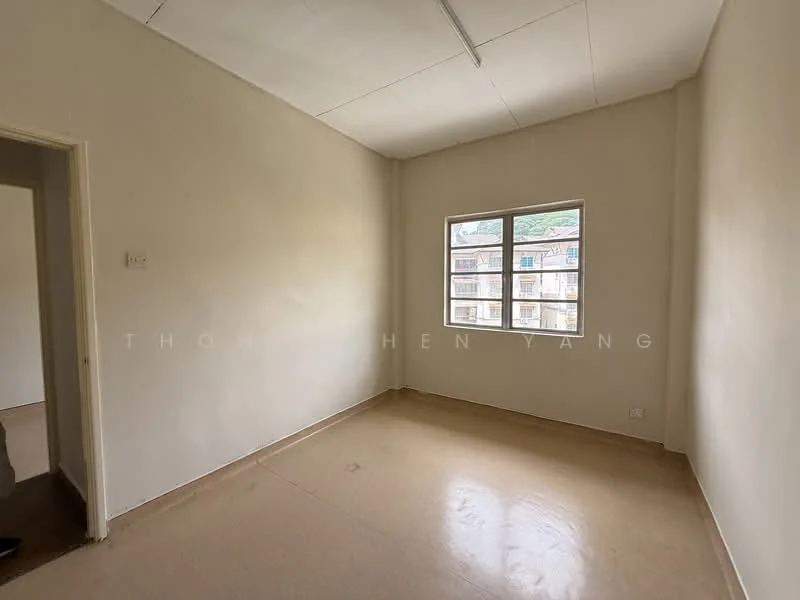 Room features: plain white walls, smooth ceiling, single window, vinyl flooring, no visible furniture, neutral color scheme, natural light from window, corner room; style: minimalist.