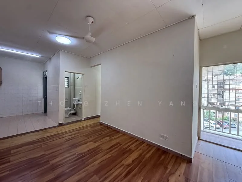 Room features: wooden flooring, white painted walls, ceiling fan, window with view, doorway leading to bathroom, doorway leading to another room, natural light from window, plain ceiling.