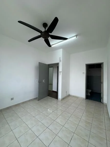 Room features: white painted walls, tile flooring, 5-blade ceiling fan, fluorescent ceiling light, two doors leading to other spaces, window with no visible treatment, corner of a bathroom visible through door.