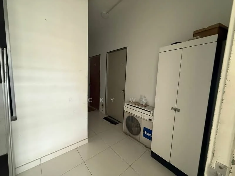 Laundry features: white walls, white tiled flooring, washing machine, built-in cabinet with white doors, door leading to another room, doorway to hallway, light fixture on ceiling.