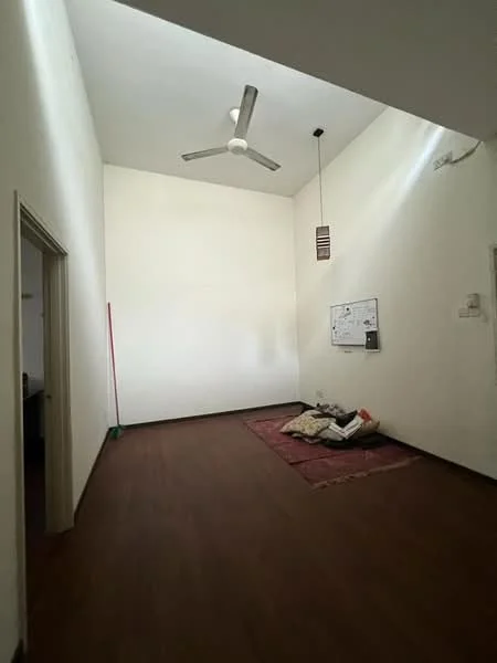 Room features: white painted walls, wooden flooring, 5-blade ceiling fan, high ceiling, hanging light fixture, area rug, blank wall space, doorway leading to another room; style: minimalist.