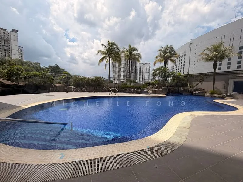 Exterior type: swimming pool deck; features: infinity pool, pool deck with loungers, tropical landscaping with palm trees, stone-paved walkway, surrounded by residential buildings, blue water, curved pool shape; style: modern.