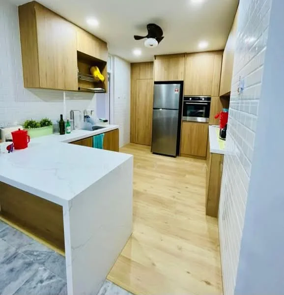 Kitchen features: white marble countertop, wood cabinetry, stainless-steel fridge, built-in oven, 4-burner gas hob, single-bowl stainless-steel sink, chrome pull-down faucet, pendant light, wood laminate flooring, white tiled backsplash, open shelving, kitchen island; style: modern.
