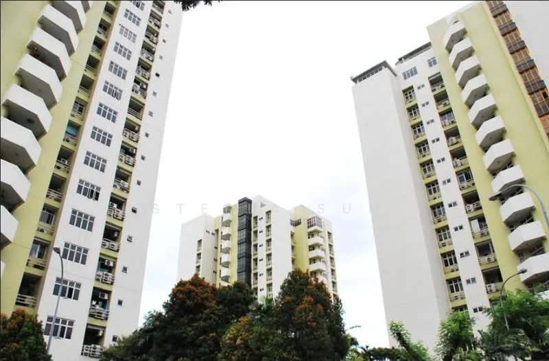 Exterior type: high-rise condominium; features: yellow painted facade, white painted facade, recessed balconies, multiple storeys, surrounded by greenery, urban context; style: modern.