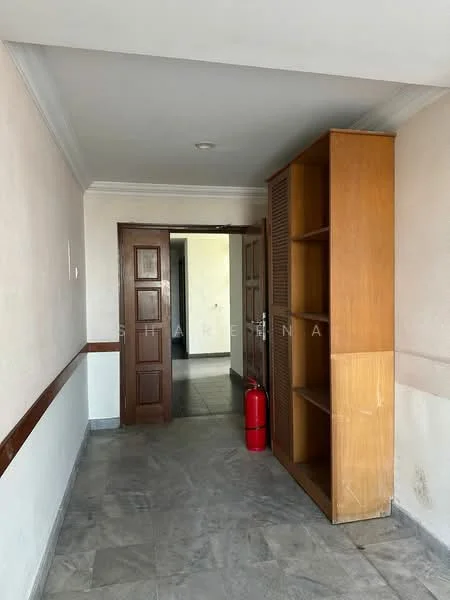 Room features: white painted walls, grey marble flooring, wooden door, built-in wooden shelving unit, fire extinguisher, crown moulding, light ceiling, doorway leading to another room.