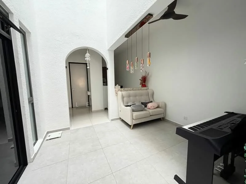 Living features: light grey tiled flooring, white painted walls, high ceiling, sofa in light beige fabric, wooden ceiling fan, hanging pendant lights, piano, arched doorway, large glass sliding door, decorative wall art, small side table; style: modern.