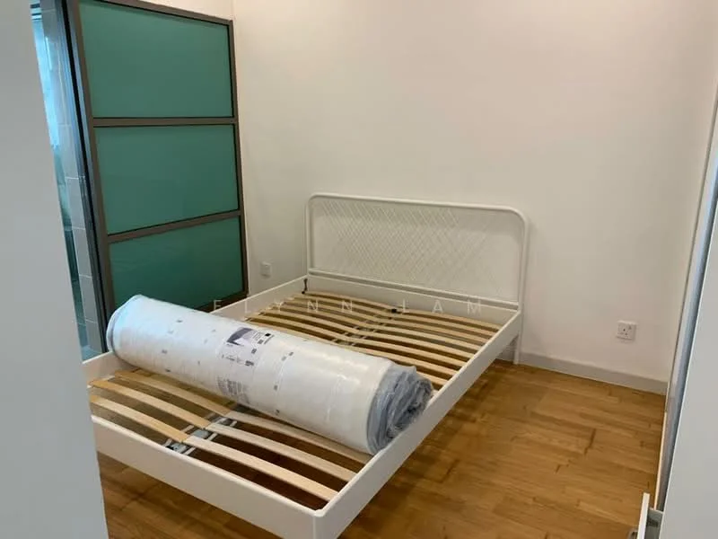 Bedroom features: wooden flooring, white painted walls, single bed frame with slatted base, rolled mattress, green glass sliding wardrobe doors, natural light from window, minimalist decor; style: modern.