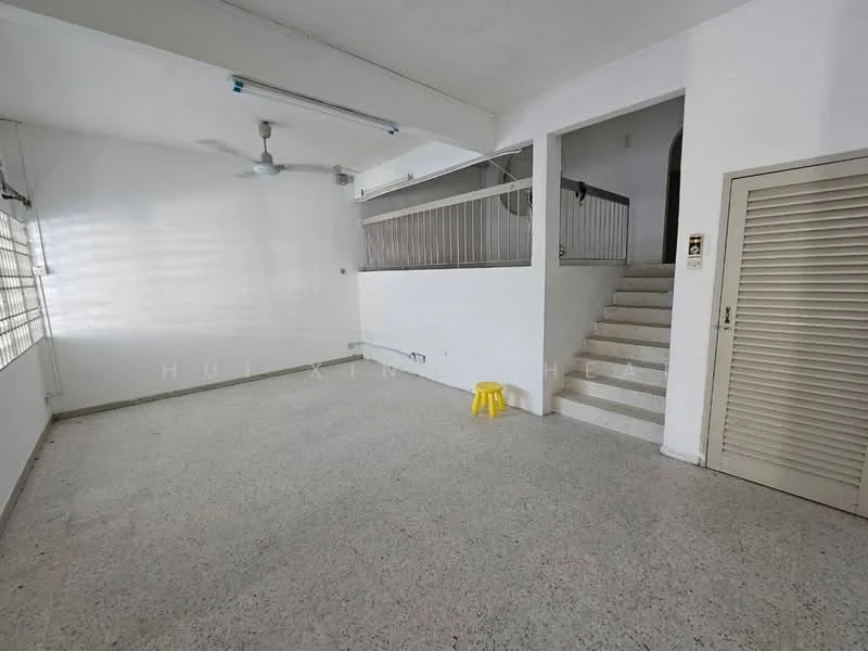 Room features: white painted walls, grey terrazzo flooring, ceiling fan, staircase leading to upper level, window with blinds, door with louvered panels, yellow plastic stool; style: minimalist.