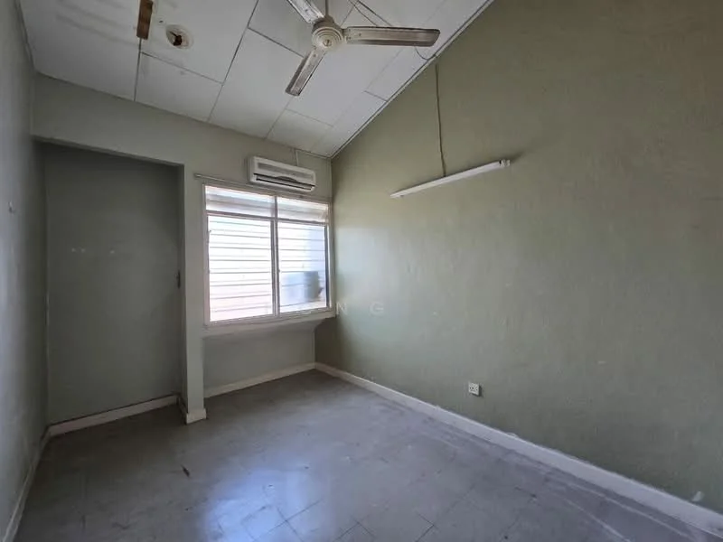 Room features: green painted walls, white ceiling, ceiling fan, wall-mounted split AC, window with blinds, tile flooring, light fixture, door to adjacent room.