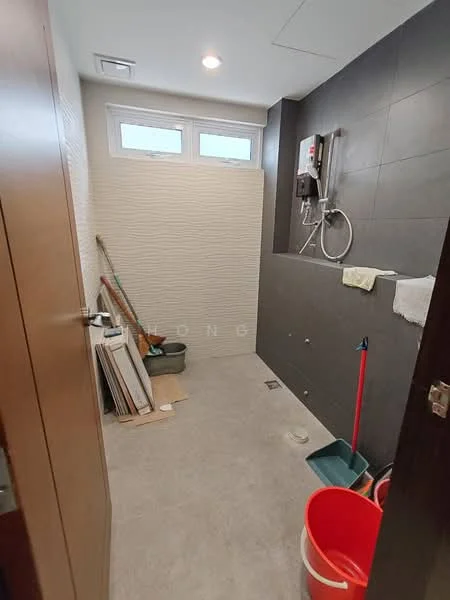 Bathroom features: grey tile flooring, white textured wall, black accent wall, shower area with wall-mounted shower, window for natural light, cleaning supplies visible, squeegee, bucket, broom, towel hanging, drain in floor; style: modern.