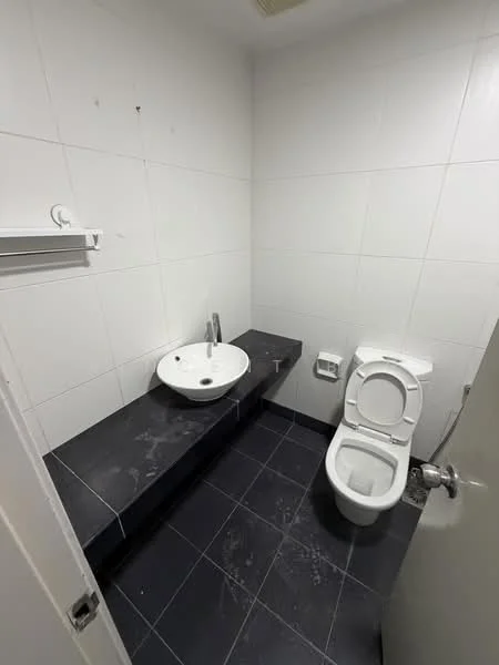 Bathroom features: white ceramic toilet, single-bowl sink, chrome faucet, black stone countertop, white tiled walls, black tiled flooring, wall-mounted towel rack, flush-mounted lighting; style: modern.