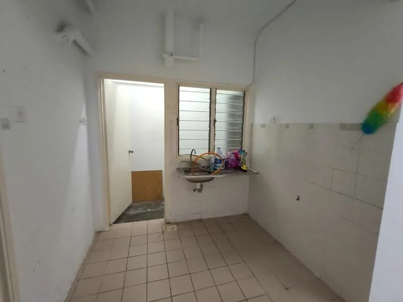 Room features: white painted walls, tile flooring, single-bowl stainless-steel sink, wall-mounted faucet, window with metal grille, door leading to another room, countertop, various items on countertop.