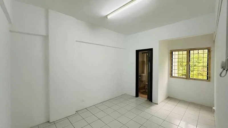 Room features: white painted walls, tile flooring, window with grid pattern, door leading to bathroom, fluorescent ceiling lights.