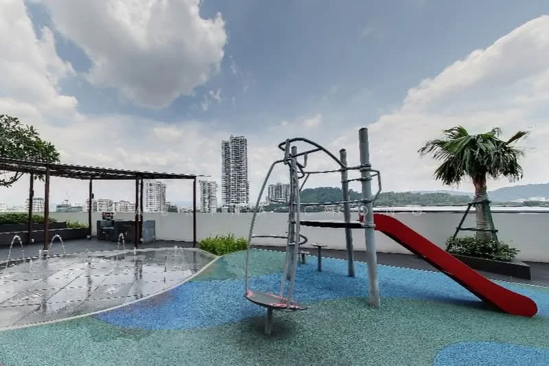 Exterior type: landscape garden; features: children's playground with climbing structure, red slide, water fountain features, tropical landscaping with palm trees, manicured lawn, paved flooring, city skyline in background, covered seating area with pergola; style: modern.