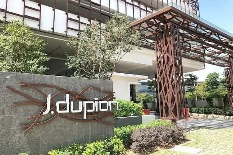 Exterior features: modern facade, landscaped garden, decorative entrance structure, signage with artistic design, paved walkway, greenery with shrubs, planters with plants; style: modern.