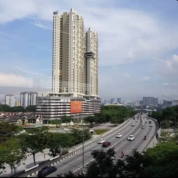 Exterior type: high-rise condominium; features: glass curtain wall, white painted facade, recessed balconies, approximately 30-storey high-rise, surrounded by mature greenery, fronts a main road, urban skyline view in background; style: modern.