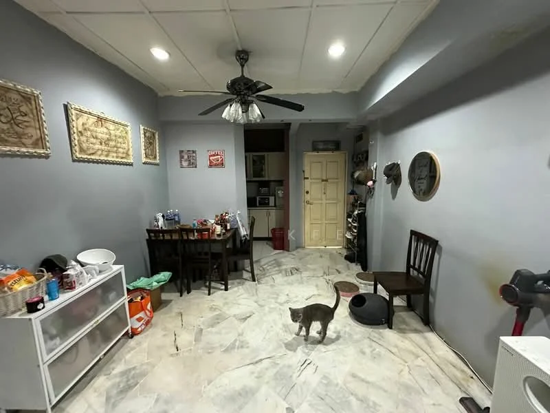 Living features: grey painted walls, marble flooring, 5-blade ceiling fan with light, dining table with chairs, white sideboard, wall-mounted mirror, decorative wall art, open kitchen view, cat, wooden chairs, floor mat; style: modern.