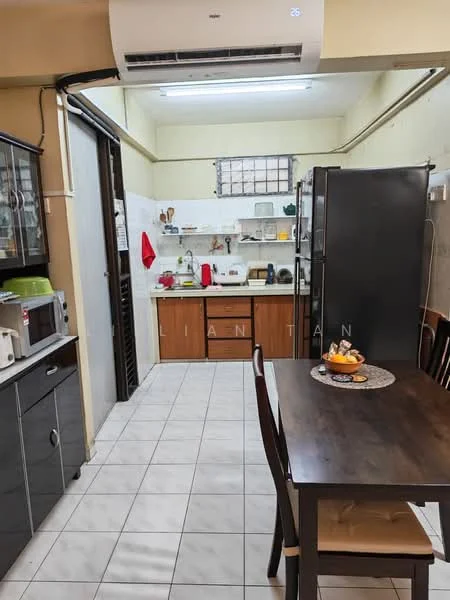 Kitchen features: white tiled walls, grey tiled flooring, wood cabinetry, stainless-steel fridge, built-in microwave, freestanding oven, double-bowl stainless-steel sink, chrome pull-down faucet, kitchen countertop, dining table with four chairs, air conditioning unit, open shelving, kitchen utensils on countertop, fruit bowl on dining table; style: modern.