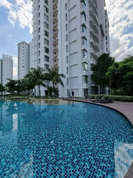 Exterior type: high-rise condominium; features: white painted facade, glass balcony railings, swimming pool with mosaic tiles, landscaped garden with palm trees, pool deck with loungers, surrounding greenery, multiple storeys, skyline view in background; style: modern.