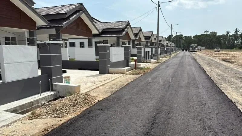 Exterior type: linked terrace house; features: grey painted facade, white rendered walls, pitched tile roof, manicured lawn, paved walkway, street lighting, newly paved road, surrounded by greenery, driveway with interlocking pavers; style: modern.