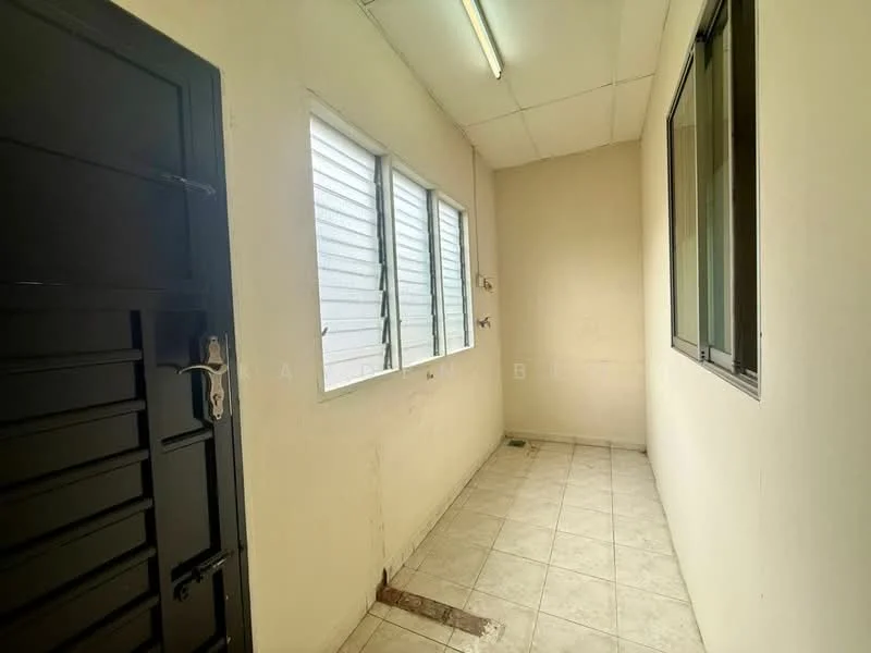 Room features: white painted walls, tile flooring, two windows, single door, fluorescent ceiling light.