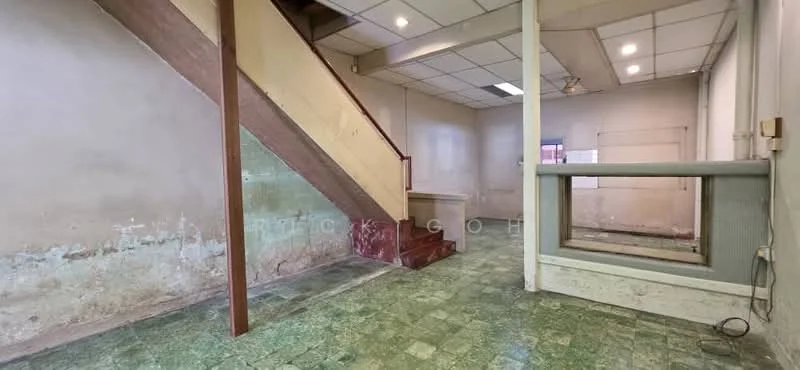 Room features: green patterned tile flooring, exposed brick walls, white painted walls, wooden staircase, ceiling lights, open space layout, large window, partition wall; style: traditional.